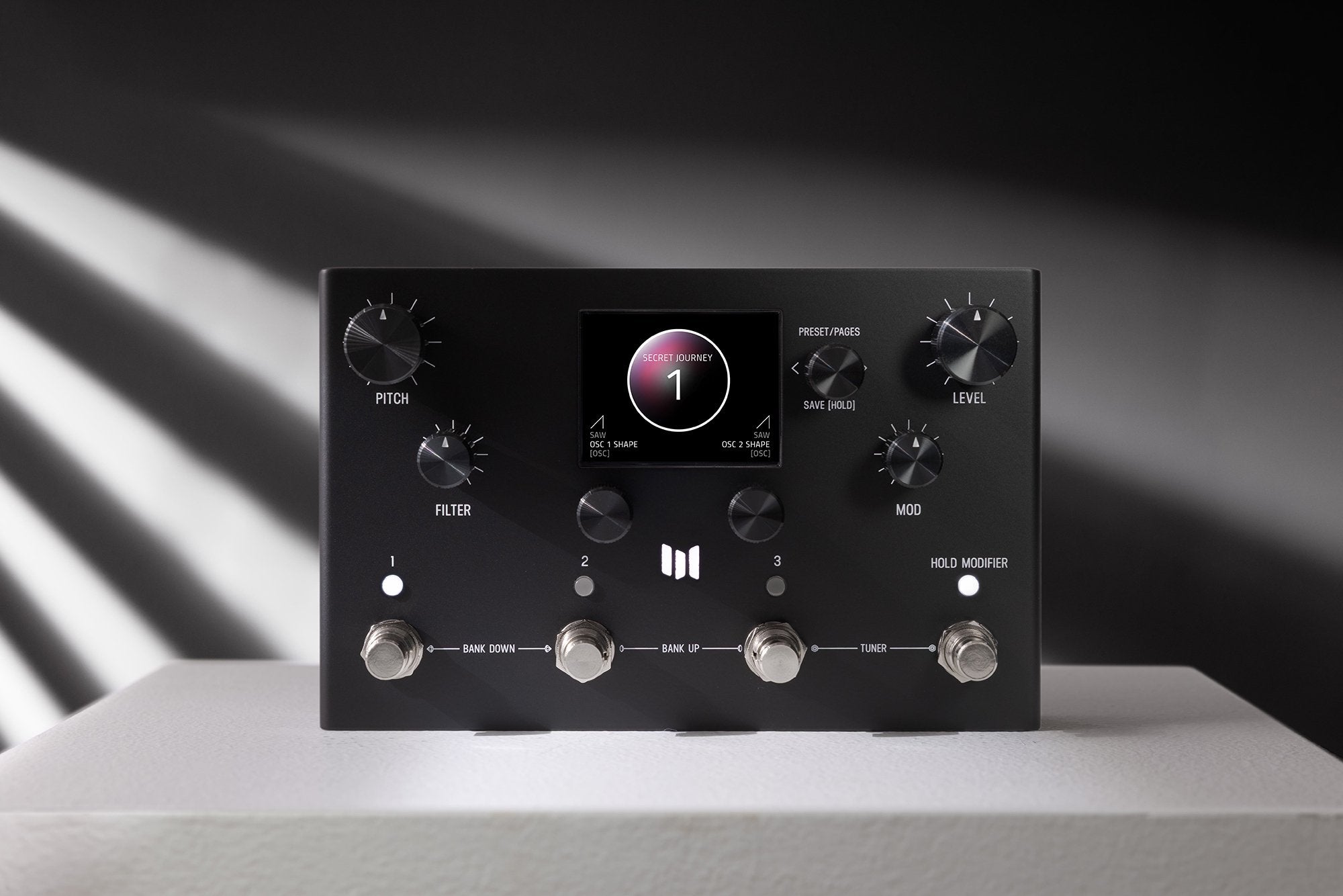 Meris Ottobit X bitcrusher pedal angled front view on a gray pedestal with dramatic studio lighting