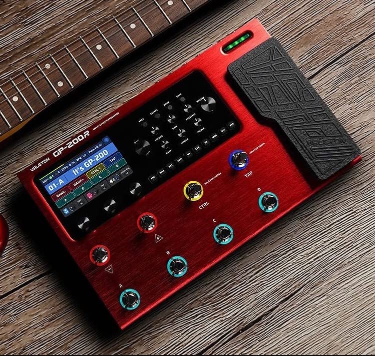Close-up of red Valeton GP-200 controls and footswitches beside guitar neck