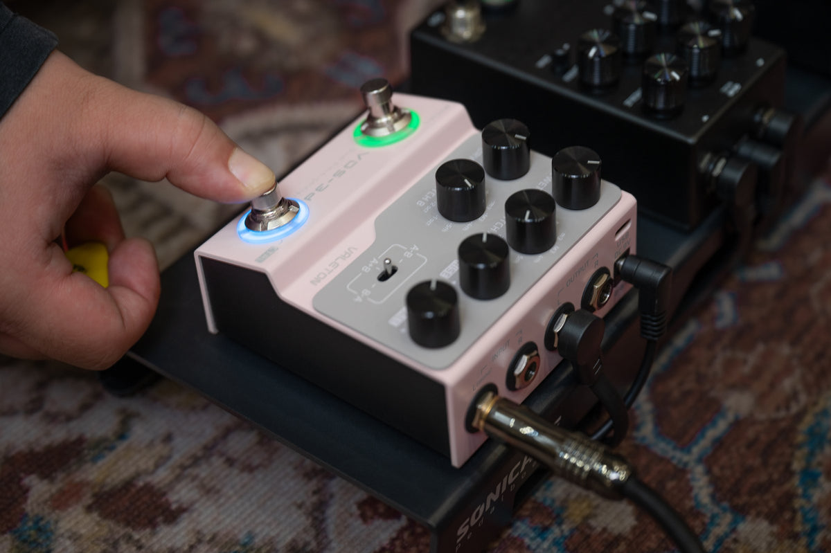 Valeton VDS-3D Digital Dual Pitch-Shifter Pedal — player pressing the footswitch on a pedalboard
