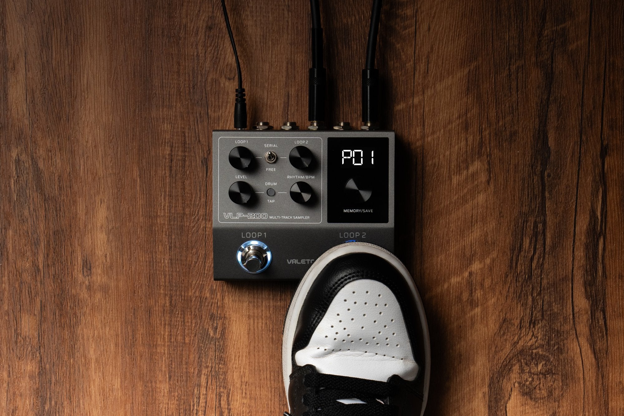 Valeton VLP-200 on stage floor with a foot approaching the footswitch