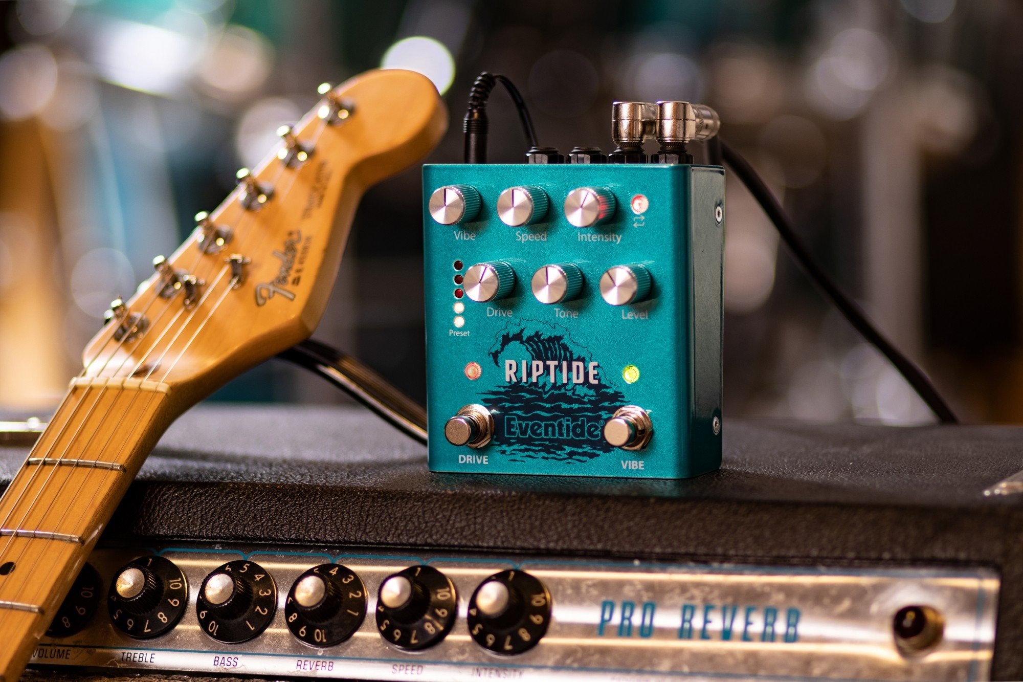 Eventide Riptide drive and Uni-Vibe pedal, lifestyle view with guitar and amplifier