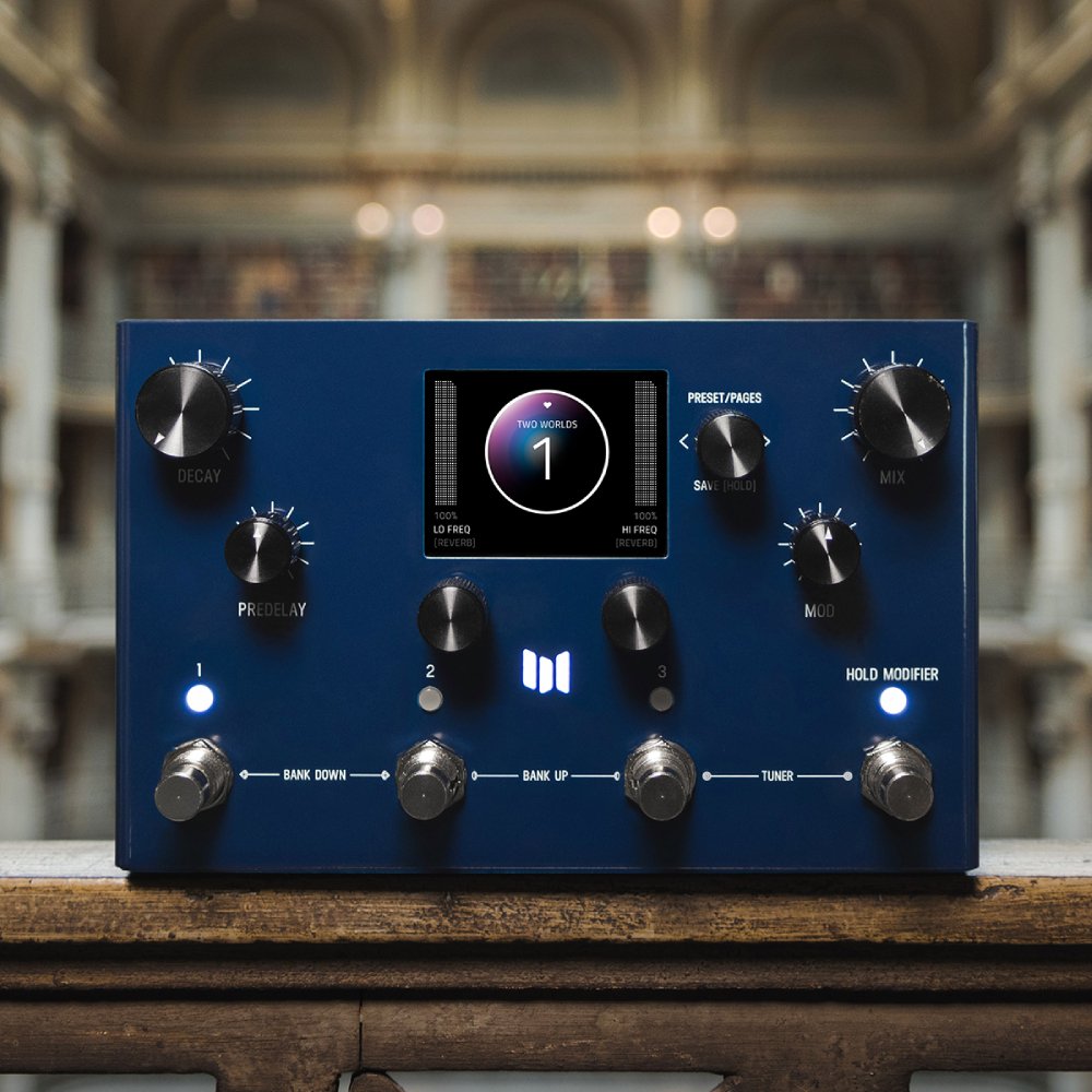 Meris MercuryX modular reverb pedal on a wooden ledge in a dimly lit ornate interior, close lifestyle shot