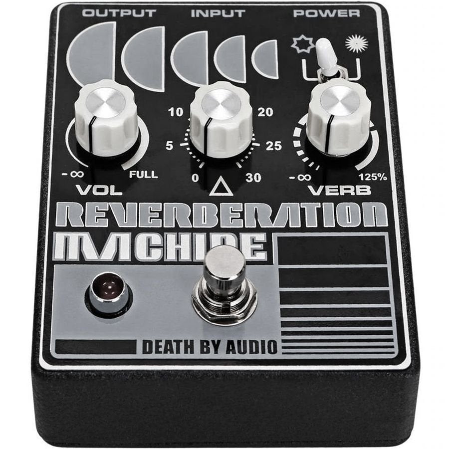 Close three-quarter view of the Death by Audio Reverberation Machine faceplate showing the control scales and toggle icons