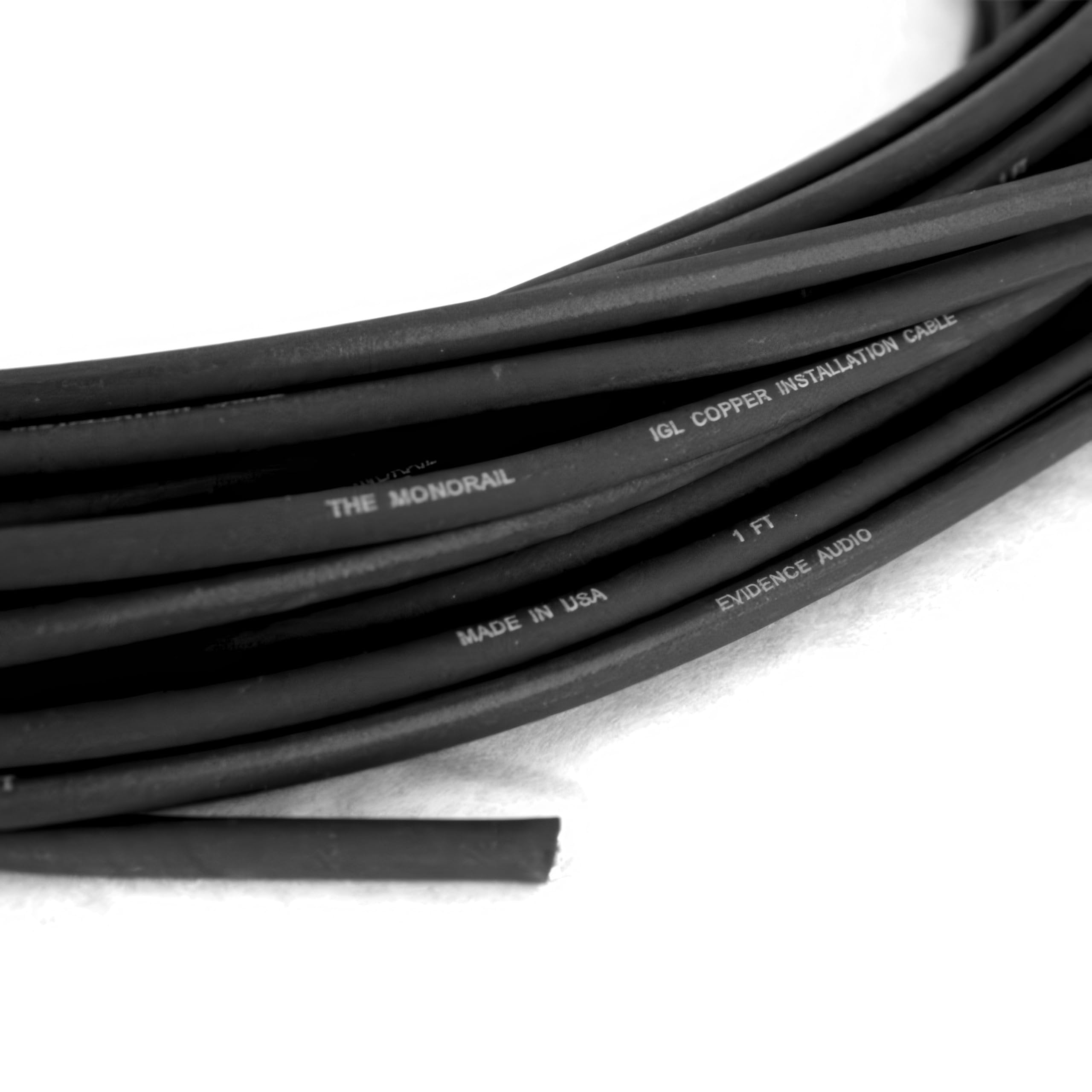 Close-up of Evidence Audio Monorail bulk cable jacket showing 'The Monorail' and 'IGL Copper Installation Cable' printing (10 ft, graphite black)