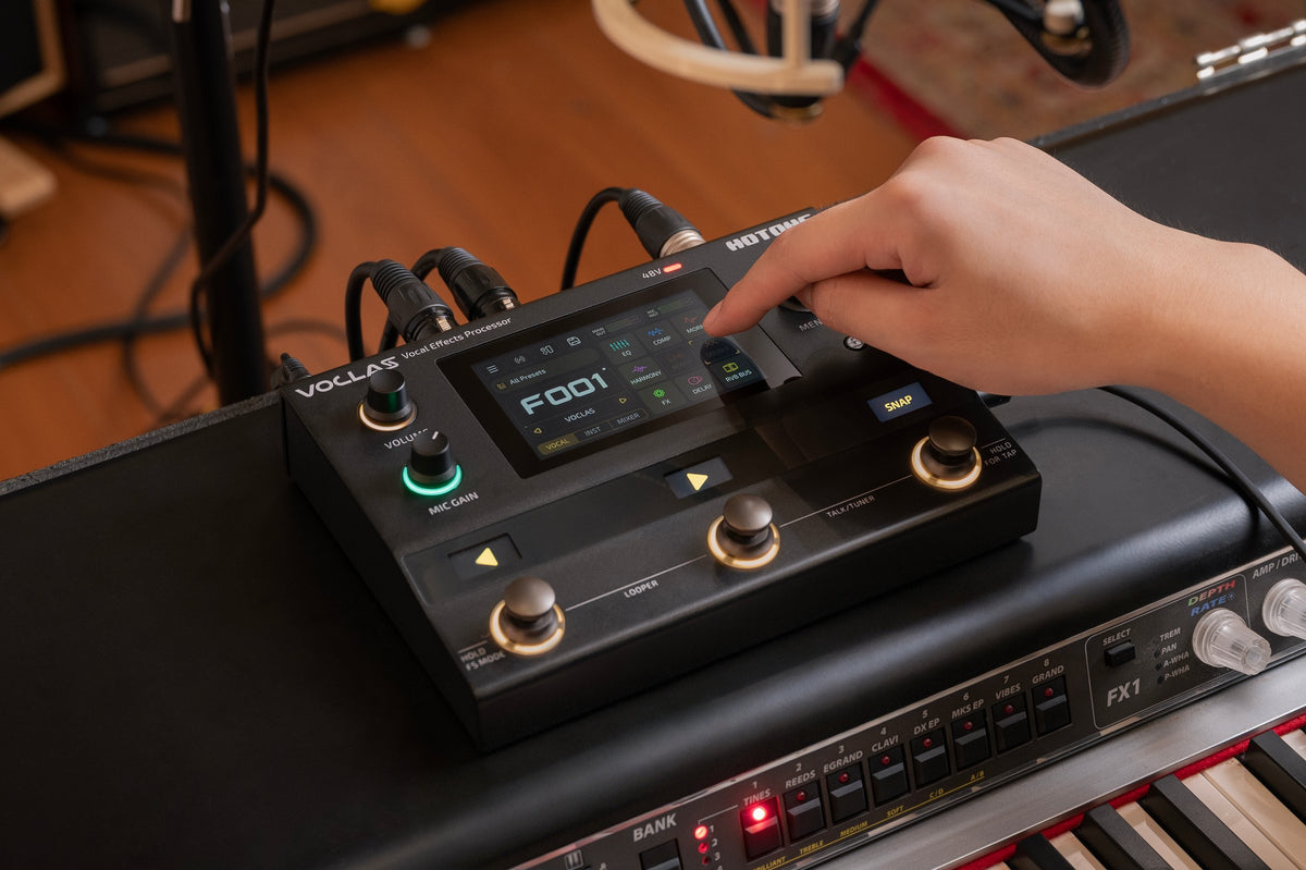Hotone Voclas VE-300 in use, selecting a preset on the touchscreen