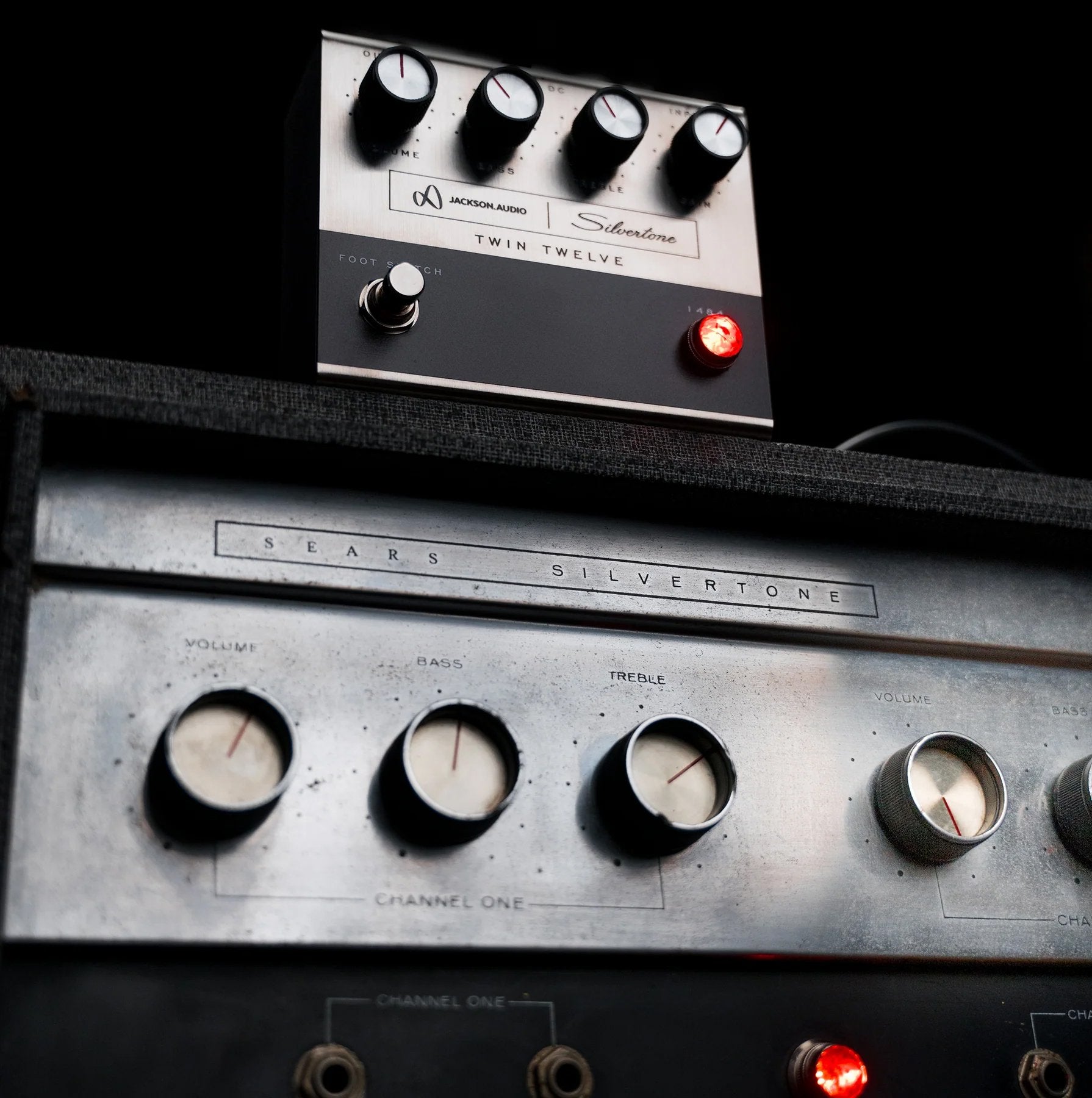 Jackson Audio 1484 Silvertone Twin Twelve Preamp/Overdrive, Lifestyle photo of the 1484 pedal positioned beside a vintage Silvertone amplifier.