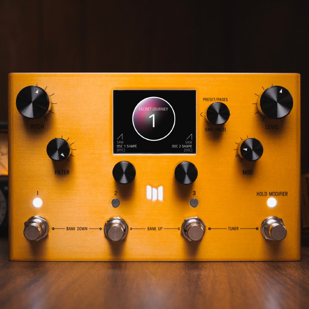 Meris Enzo X synthesizer pedal angled front view on a wood surface against a dark background