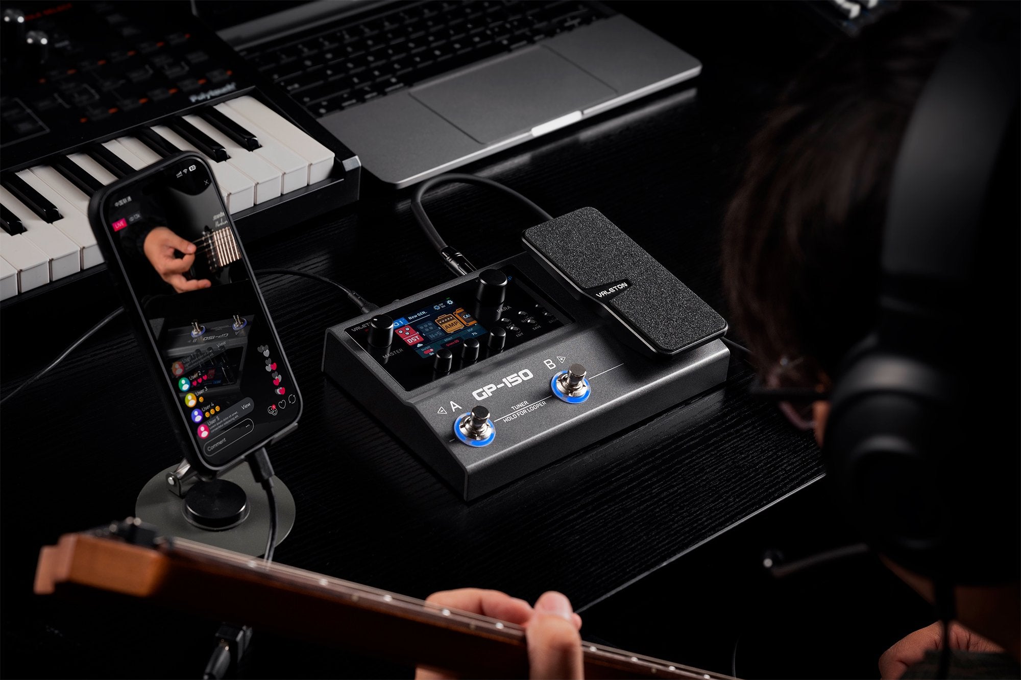 Valeton GP-150 processor used on stage next to a smartphone for wireless control