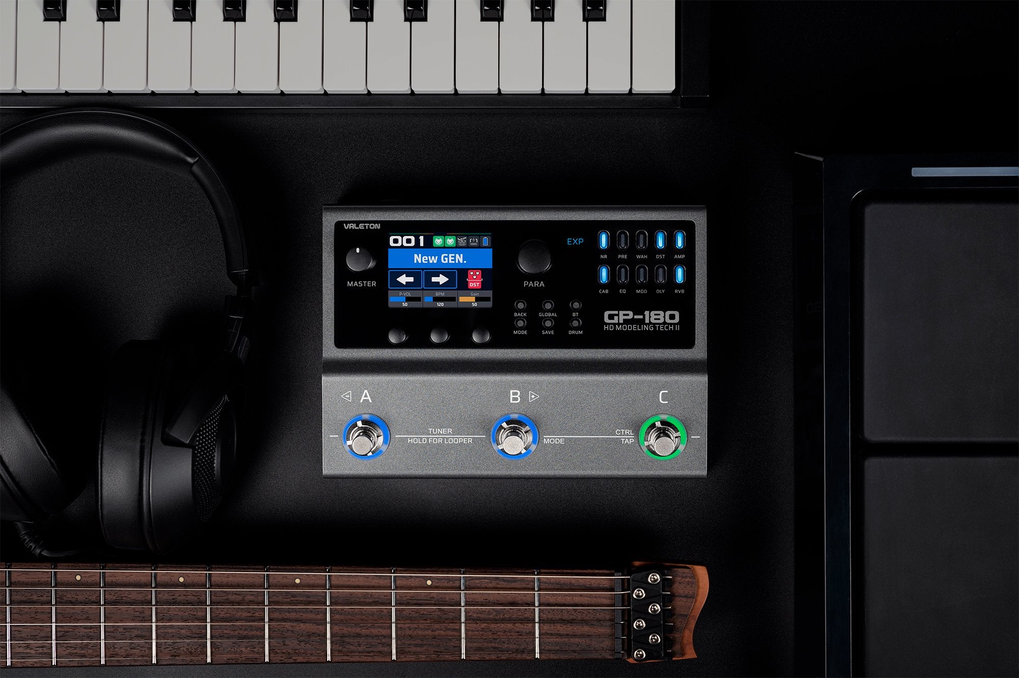 Valeton GP-180 processor in a home studio setup with keyboard and headphones