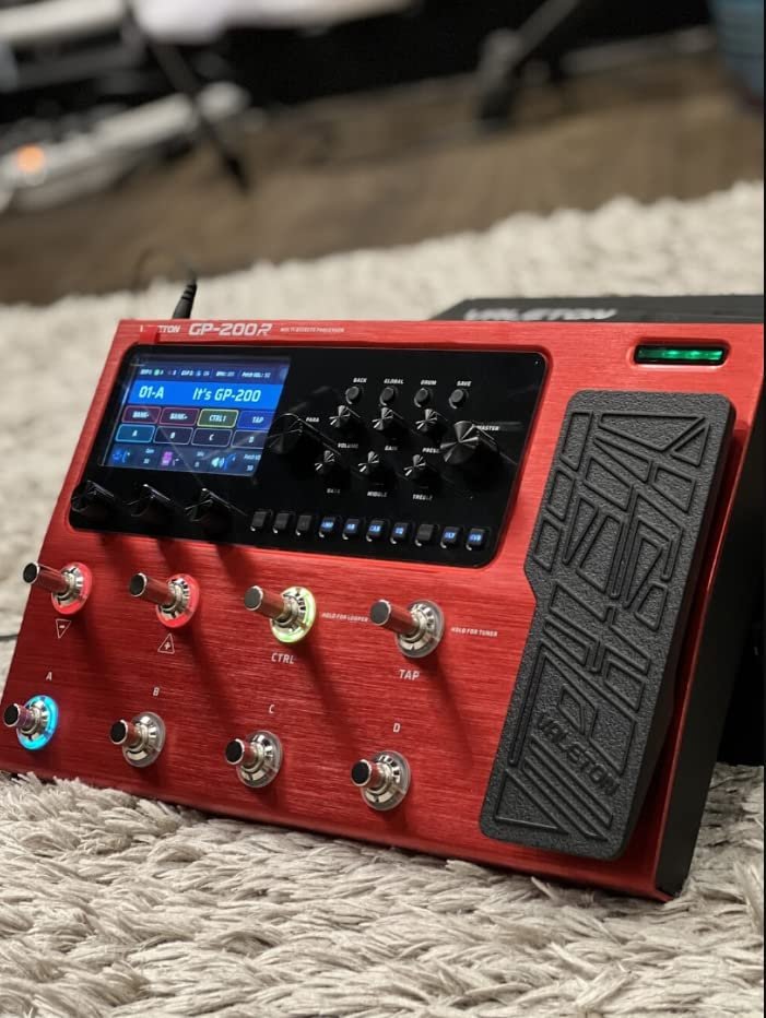 Valeton GP-200 red processor in home studio setting on a rug