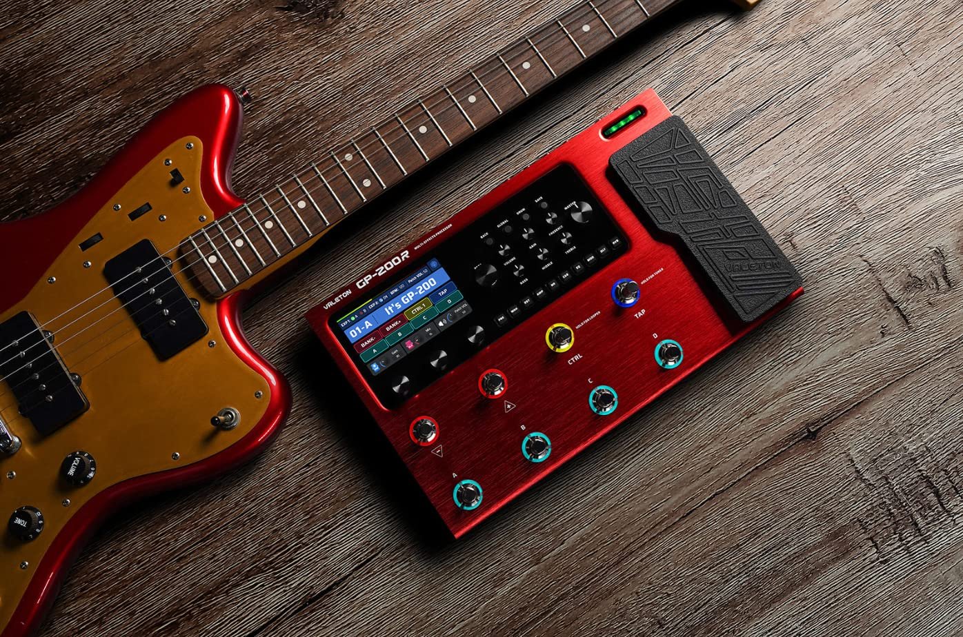 Red Valeton GP-200 processor staged next to an electric guitar