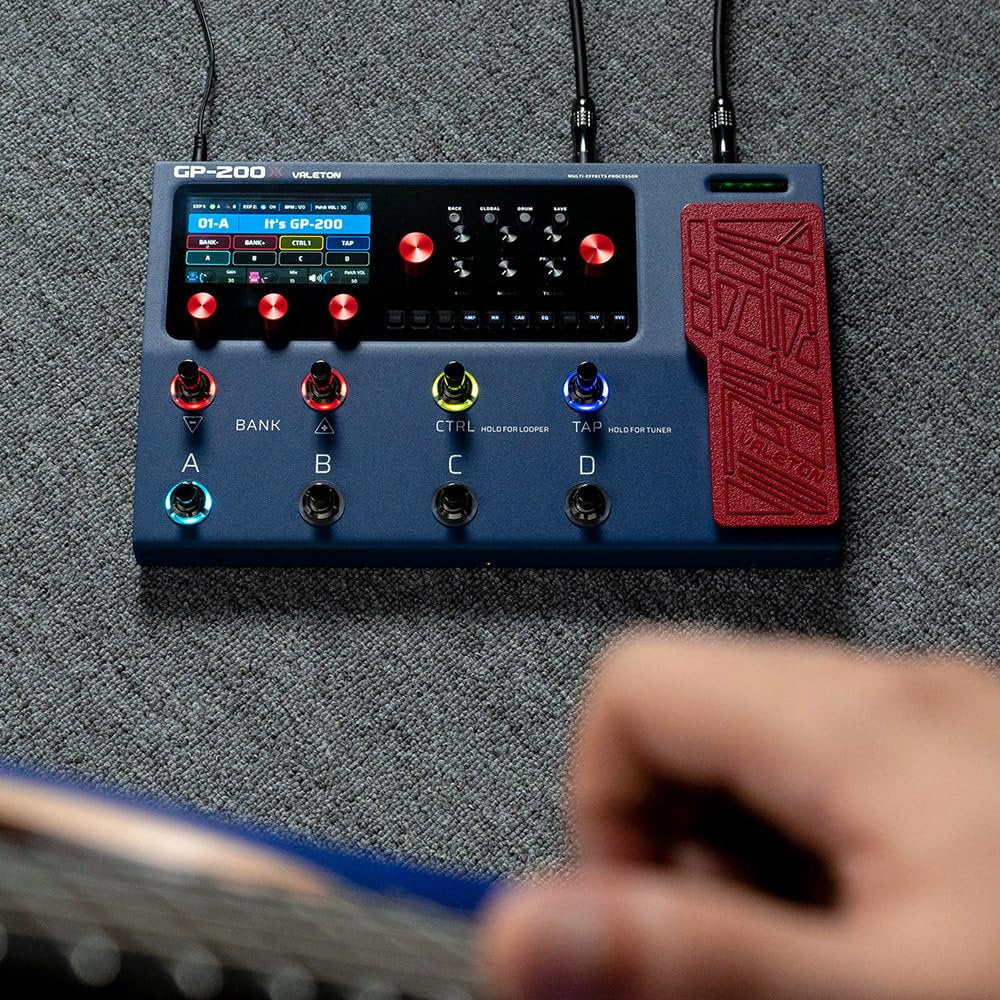 Valeton GP-200X blue processor on stage with musician adjusting footswitch