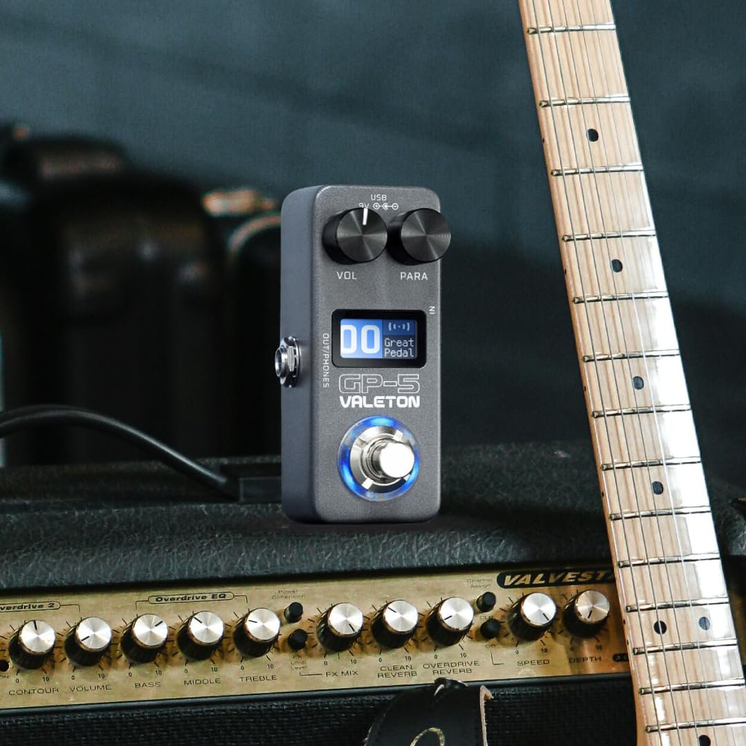 Valeton GP-5 pedal placed on a tube amplifier next to a guitar