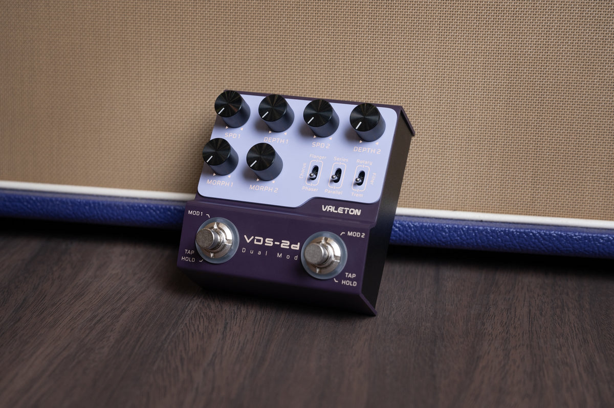 Valeton VDS-2D Digital Dual Modulation Pedal — pedal in front of a guitar amp