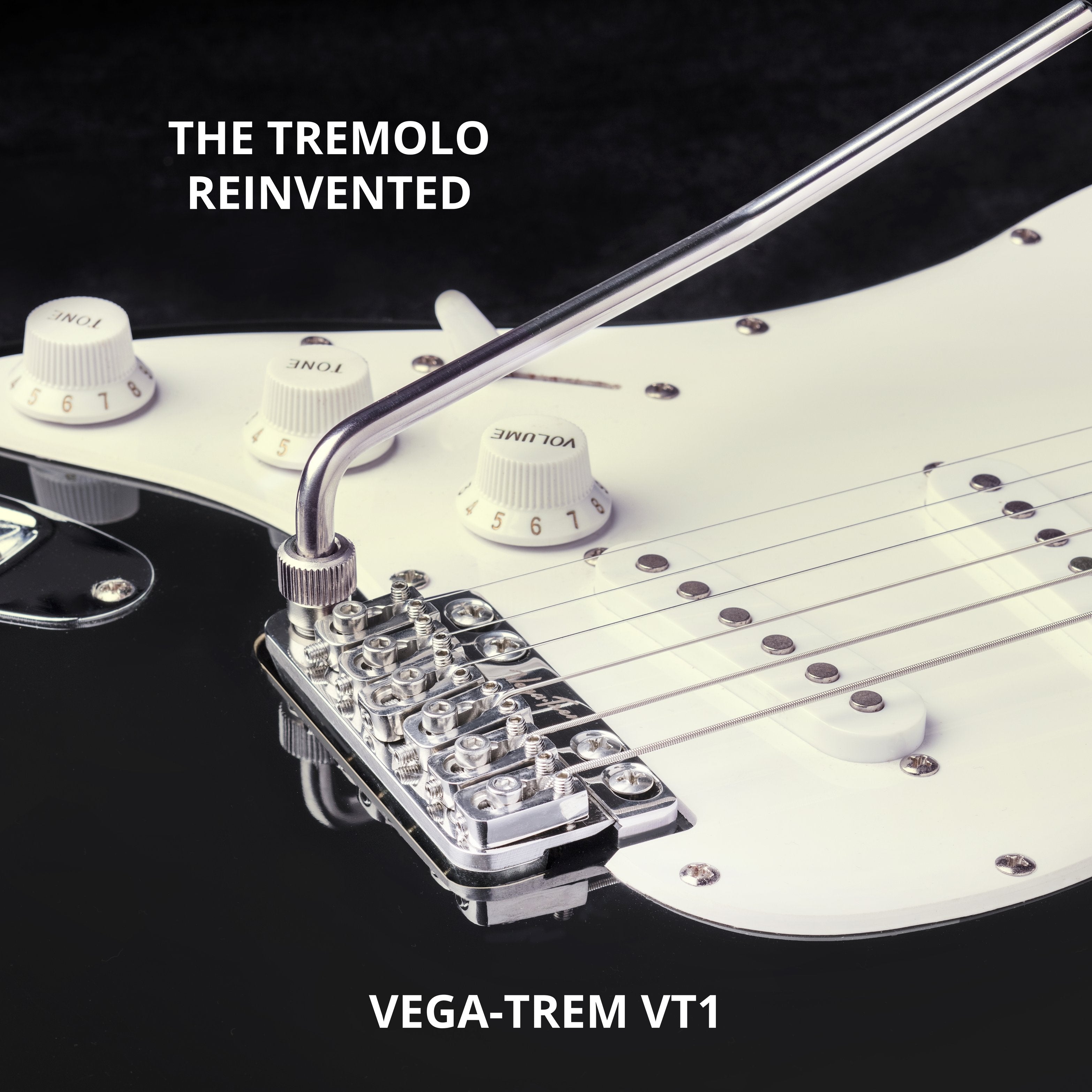 Close-up of Vega-Trem VT1 tremolo bridge installed on white pickguard, mirrored stock image used to depict left-handed orientation