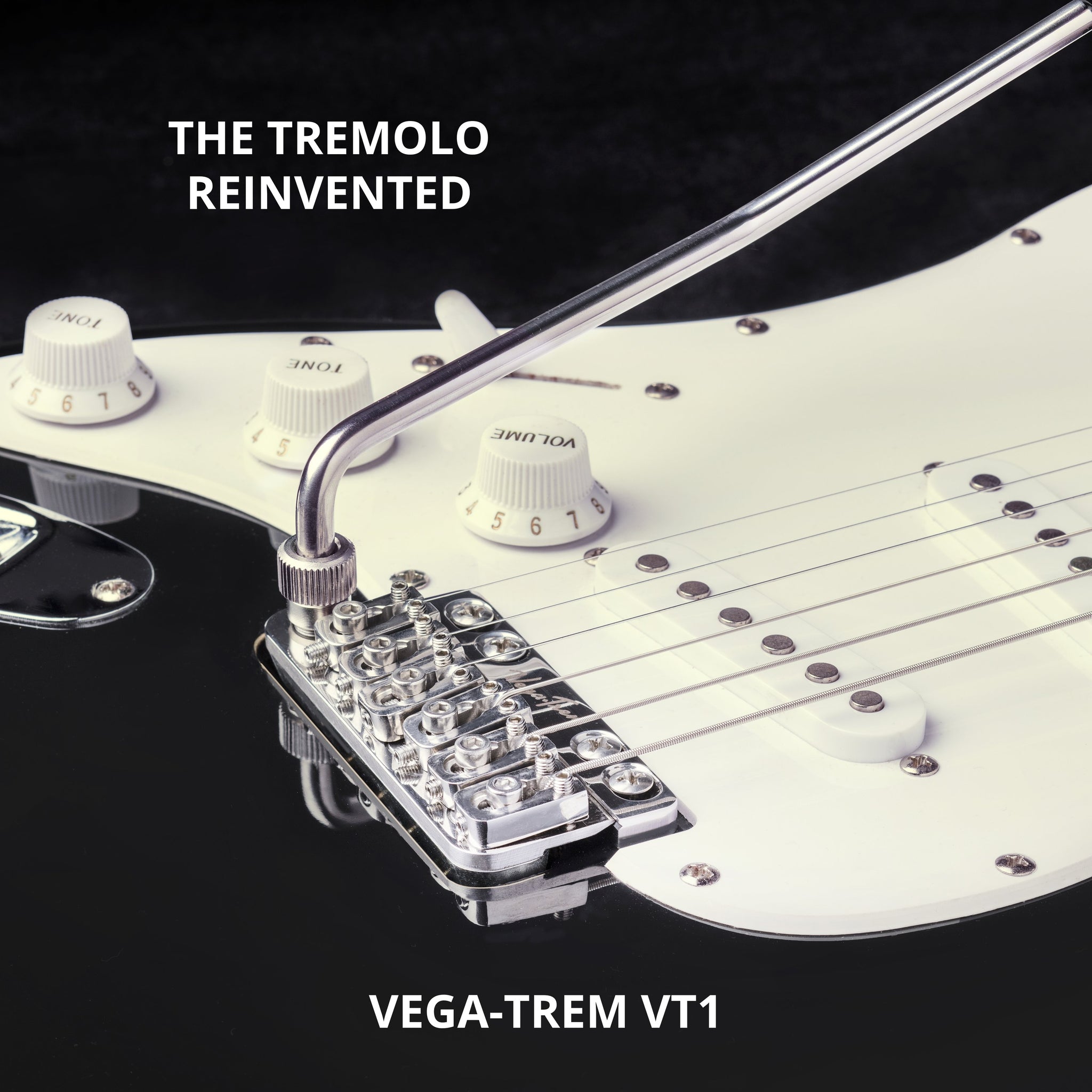 Close-up of Vega-Trem VT1 tremolo bridge installed on white pickguard, mirrored stock image used to depict left-handed orientation