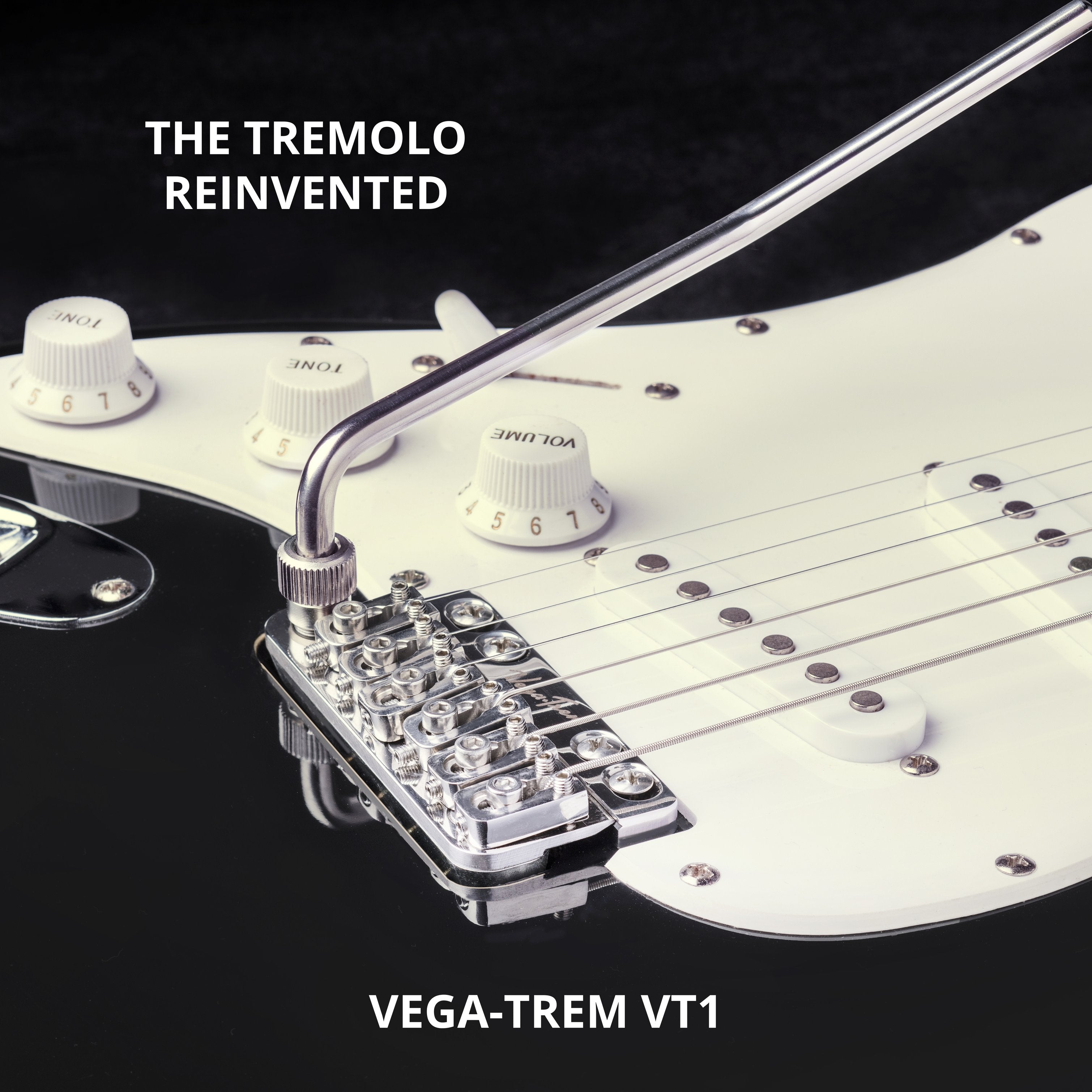 Close-up of Vega-Trem VT1 tremolo bridge installed on white pickguard, mirrored stock image used to depict left-handed orientation
