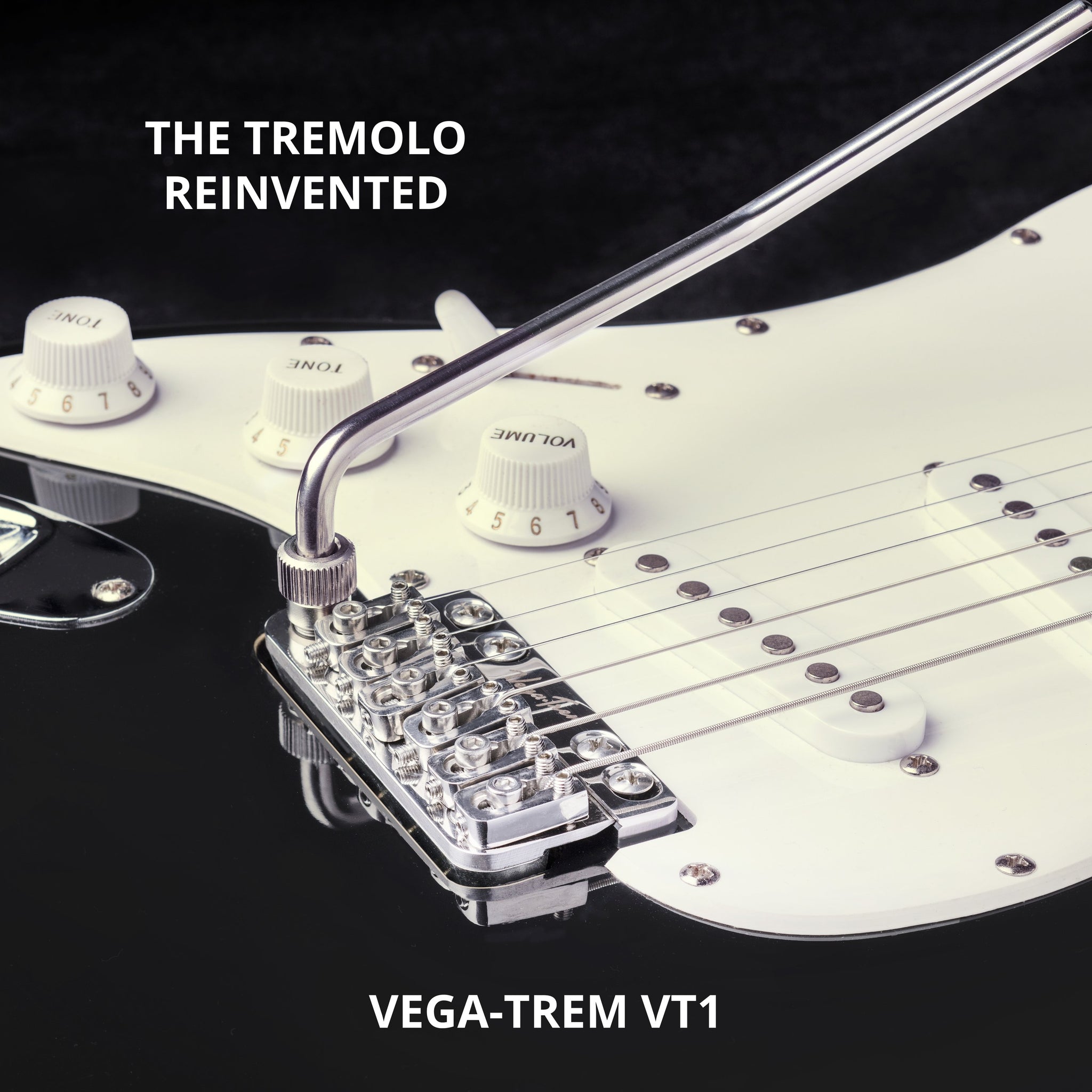Close-up of Vega-Trem VT1 tremolo bridge installed on white pickguard, mirrored stock image used to depict left-handed orientation