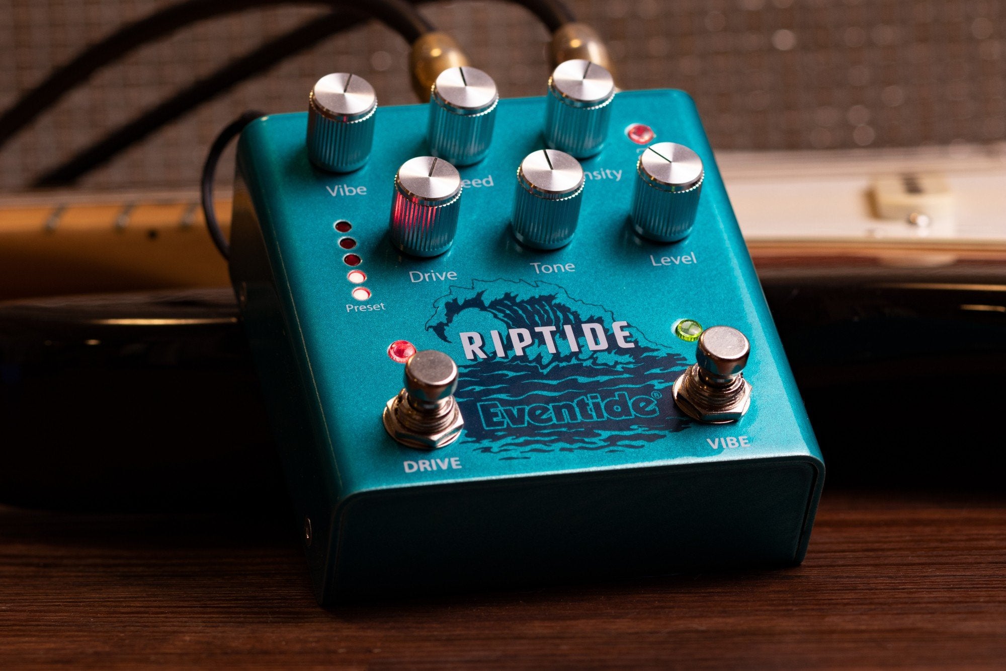 Eventide Riptide drive and Uni-Vibe pedal, lifestyle view beside an amplifier
