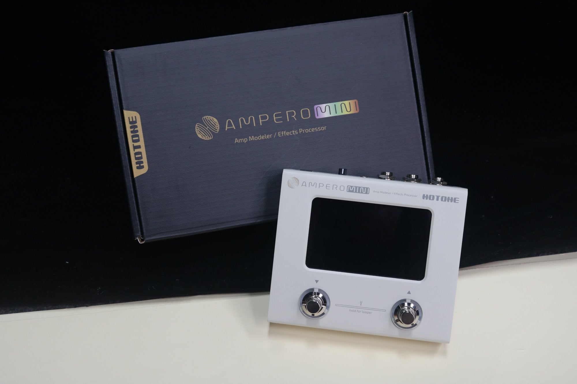 Hotone Ampero Mini amp modeler with its retail packaging box
