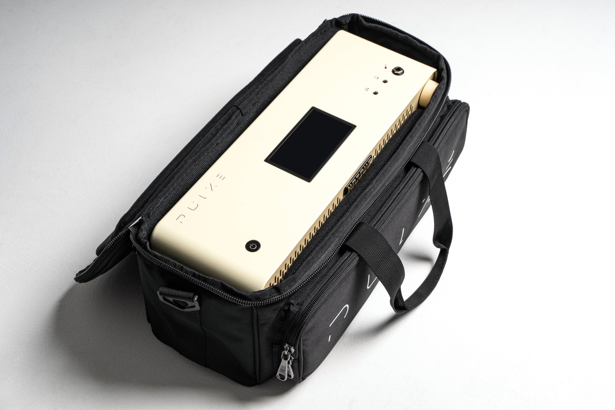 Hotone Pulze amplifier packed inside its black padded carrying case