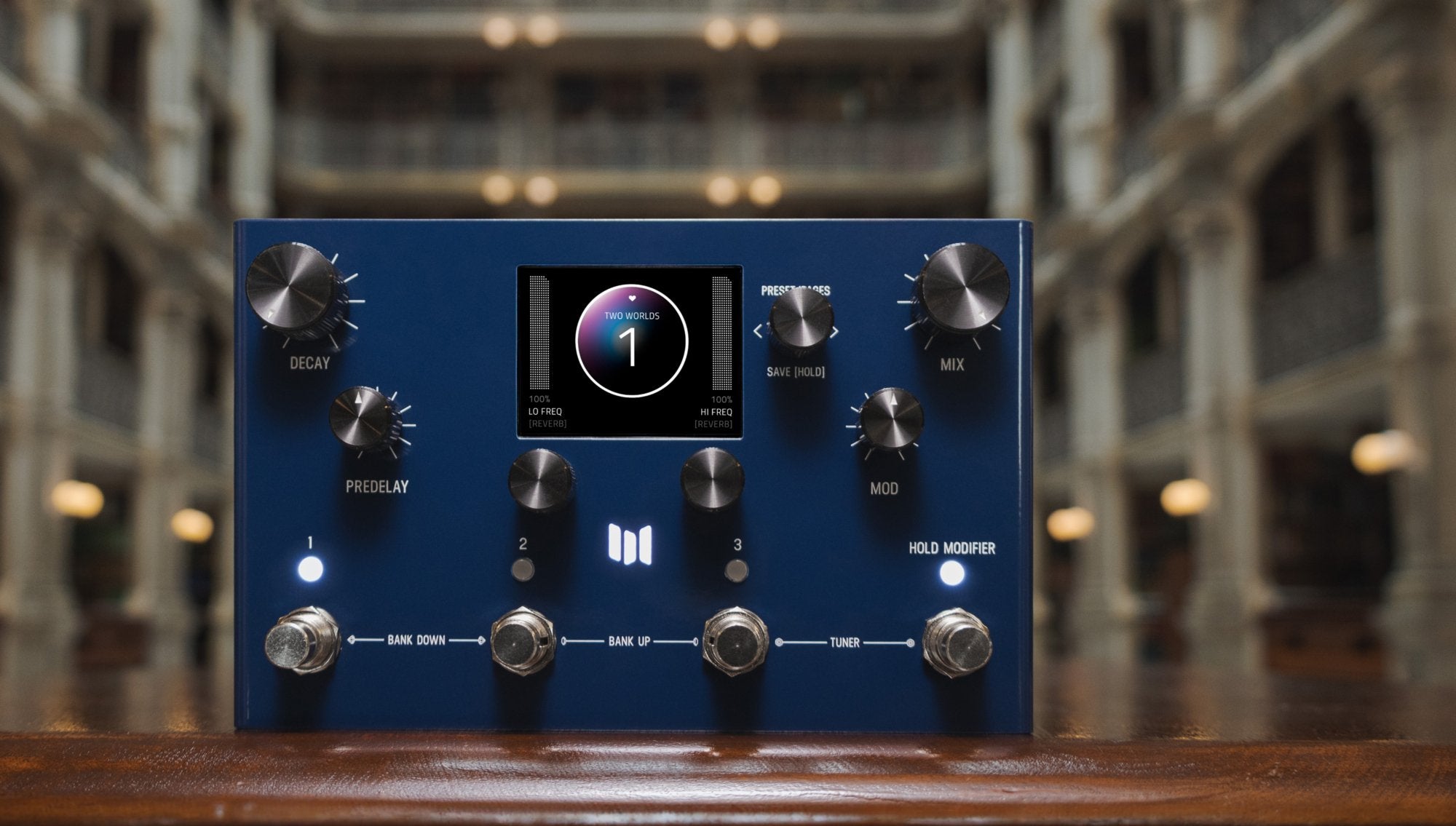 Meris MercuryX modular reverb pedal on a wooden ledge with a wide view of the surrounding ornate interior